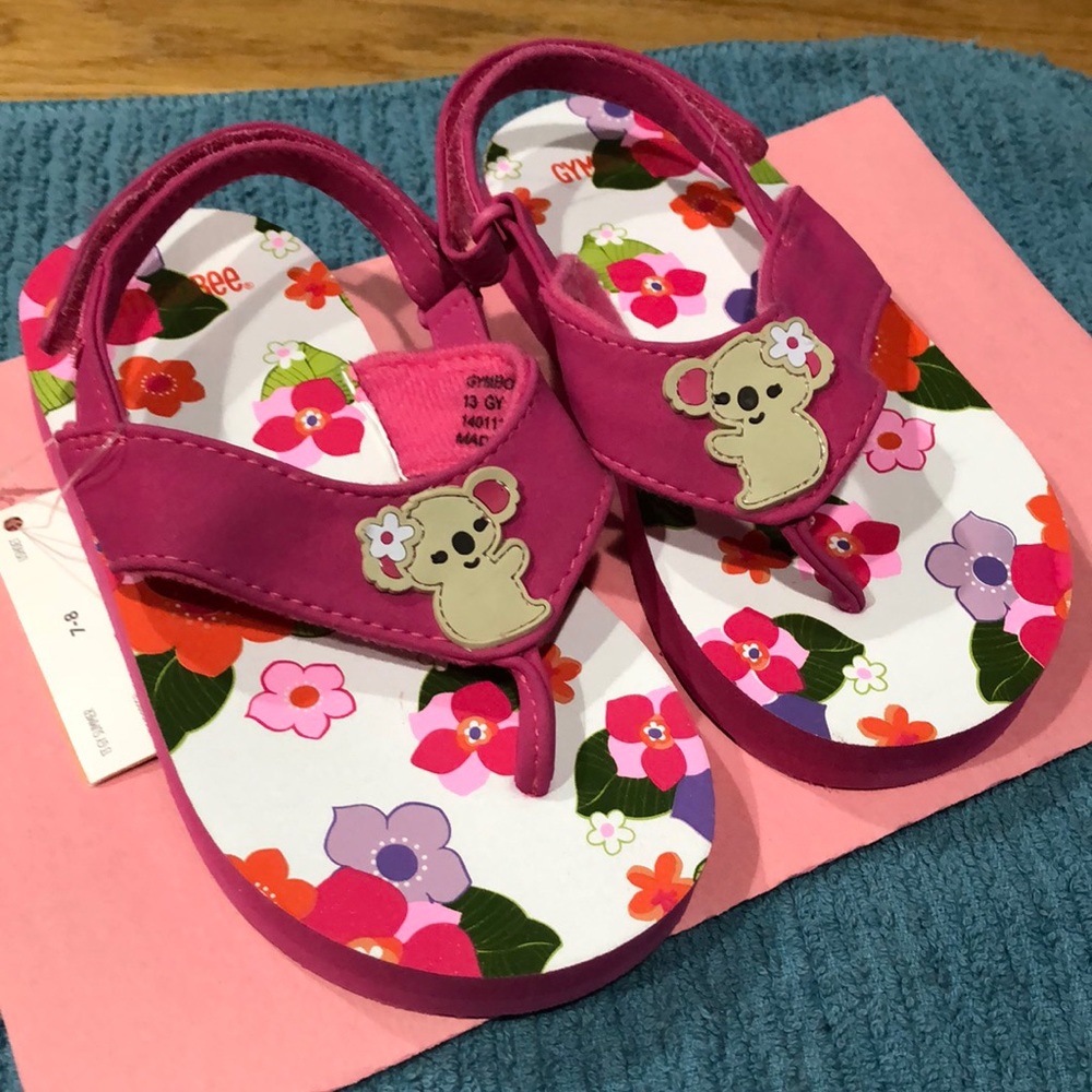 Pink flowery flip flops with bear size 7/8